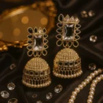 A ALLOY GOLDEN JHUMKA EARRING.