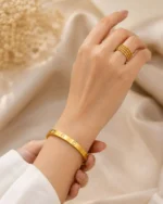 Elegant gold plated bracelet and layered ring combo set for women by Mellafex