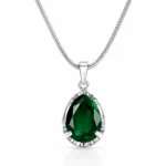 Elegant green crystal pendant with silver finish for a stylish and graceful look.
