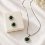 Elegant emerald green crystal pendant and earrings set for women by Mellafex
