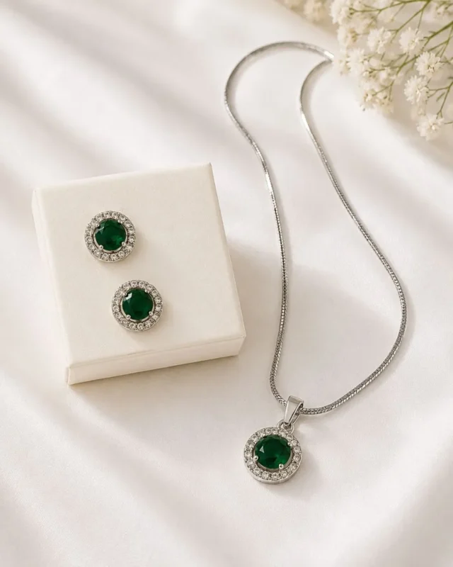 Elegant emerald green crystal pendant and earrings set for women by Mellafex